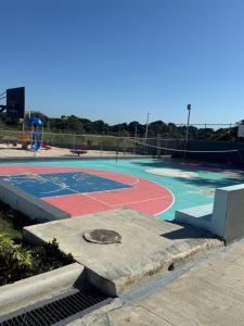 an empty basketball court in a park at Comfort and tranquility in one place in La Estrella