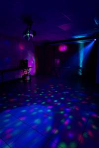 a dark room with blue and purple lights on the floor at Family villa at 1H15 from Lyon in Prétieux