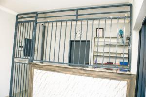 a door to a room with a cage at Silver Lake Lodge Rustenburg in Rustenburg