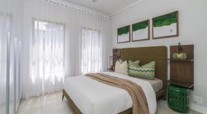 Giường trong phòng chung tại Mageba place