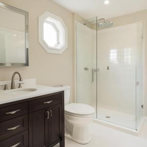 a bathroom with a shower and a toilet and a sink at Aspen Chic in Aspen