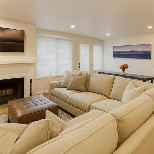 a living room with a couch and a fireplace at Aspen Chic in Aspen