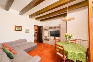 a living room with a couch and a table at Appartamenti Ischia la Sentinella in Ischia