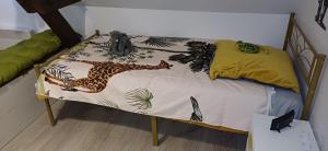 Ένα ή περισσότερα κρεβάτια σε δωμάτιο στο Maison individuelle Le Royaume Sauvage Gîte