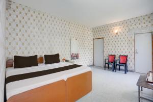 Ένα ή περισσότερα κρεβάτια σε δωμάτιο στο Hotel O Executive Inn +22 φωτογραφίες