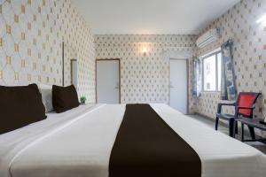 Ένα ή περισσότερα κρεβάτια σε δωμάτιο στο Hotel O Executive Inn