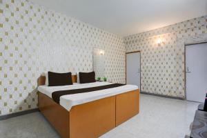 Ένα ή περισσότερα κρεβάτια σε δωμάτιο στο Hotel O Executive Inn