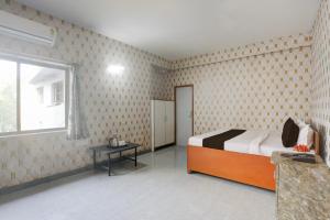 Ένα ή περισσότερα κρεβάτια σε δωμάτιο στο Hotel O Executive Inn