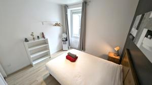 Ένα ή περισσότερα κρεβάτια σε δωμάτιο στο Le cosy nest