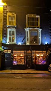 a store front of a building at night at The Overlook Bed and Breakfast in Glastonbury