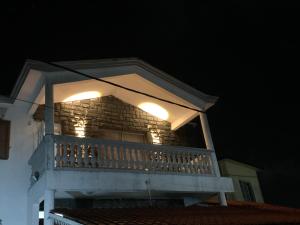 a balcony with lights on top of a house at FINRAH Rental Property Ltd in Curepipe +2 photos