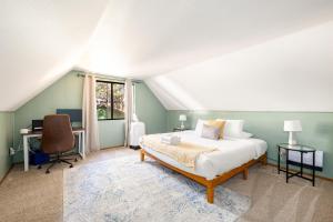 a bedroom with a bed and a desk at Whispering Pines: Foosball Grill More in Mountainaire