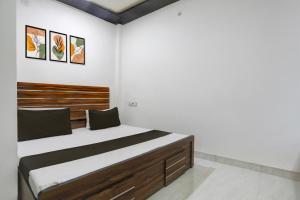 Ένα ή περισσότερα κρεβάτια σε δωμάτιο στο Hotel O stay inn