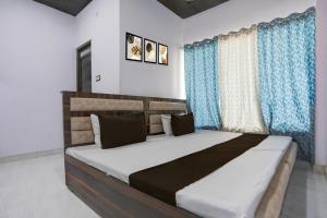 Ένα ή περισσότερα κρεβάτια σε δωμάτιο στο Hotel O stay inn