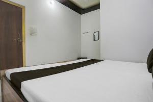 Ένα ή περισσότερα κρεβάτια σε δωμάτιο στο Hotel O stay inn