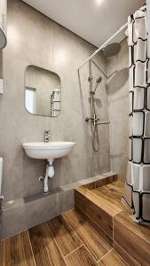 a bathroom with a sink and a mirror at Поділля in Netishyn