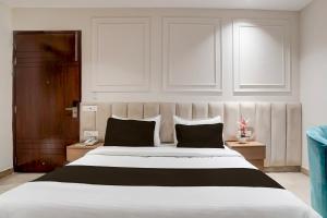 Postel nebo postele na pokoji v ubytování HOTEL O ELVILLA