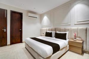 Postel nebo postele na pokoji v ubytování HOTEL O ELVILLA