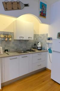 Kuchyň nebo kuchyňský kout v ubytování Stella di mare