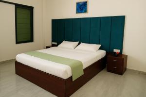 Postel nebo postele na pokoji v ubytování Karhandla Tigers Farm And Resort + 22 fotografií