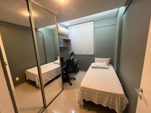 Ένα ή περισσότερα κρεβάτια σε δωμάτιο στο Vita Residencial Clube - Flat 3 Quartos por Yolo +6 φωτογραφίες