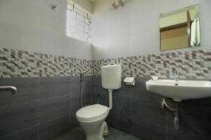 Koupelna v ubytování Hotel O Manu Residency