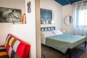 Ένα ή περισσότερα κρεβάτια σε δωμάτιο στο NellaRiserva25-Vurria