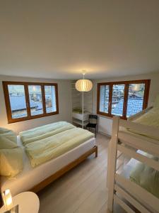 Ένα ή περισσότερα κρεβάτια σε δωμάτιο στο Apartments Soldanella