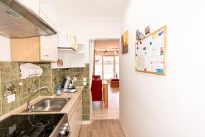 a kitchen with a sink and a counter top at Ferienwohnung Nolte Grömitz in Grömitz