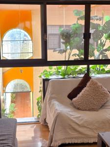 Χώρος καθιστικού στο Bamboo Habitación Talavera 1