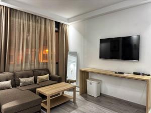 TV a/nebo společenská místnost v ubytování Home hassan