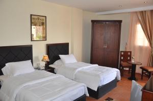 Uma cama ou camas num quarto em Best View Pyramids Hotel