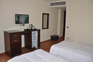 Uma cama ou camas num quarto em Best View Pyramids Hotel