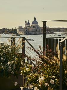 a view of the water with a building in the background at Hotel Gabrielli Venezia - Starhotels Collezione in Venice