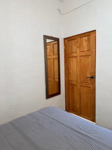 Ένα ή περισσότερα κρεβάτια σε δωμάτιο στο Pacifico