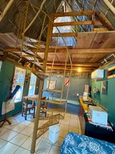 a room with a loft with a bed and a desk at Palapa Chili # in Sayulita