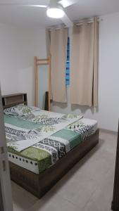 Postel nebo postele na pokoji v ubytování Les jardins suspendus des caraibes