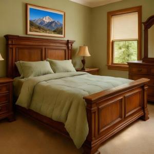 a bedroom with a large bed and a mountain at Jackson Hole Alpine Residence in Jackson