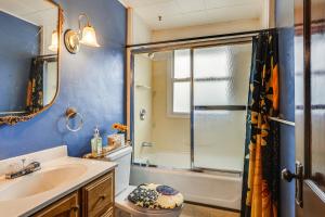 a bathroom with a sink toilet and a shower at 1 Mi to Downtown Dubuque! Spacious Home in Dubuque +32 photos