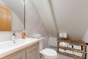 a bathroom with a sink and a toilet and a mirror at Tahoe West Shore Escape in Tahoe City +27 photos