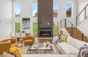 a living room with a couch and a fireplace at Ski-In Ski-Out Escape with Mountain Views in Snowm in Snowmass Village