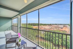 a balcony with a view of a construction at 2BR Condo with pool, near Disney! in Orlando