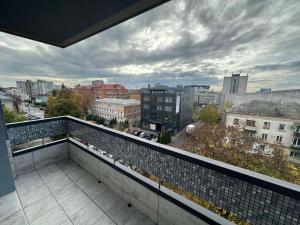 a balcony with a view of a city at Простора і сучасна євродвушка в центрі Черкас! in Cherkasy