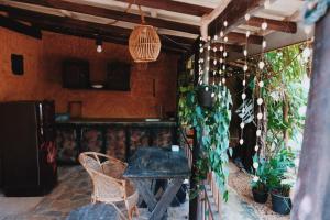 a room with a table and some plants at Birds of Paradise Surf and Yoga Boutique & Retreat in Weligama