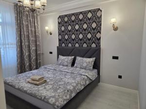 Ένα ή περισσότερα κρεβάτια σε δωμάτιο στο Транзит Сервис 1 Аэропорт- Кишинёв