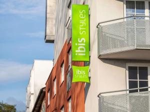 a sign on the side of a building at ibis Styles Graz Messe in Graz +87 photos