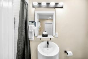 a bathroom with a sink and a mirror at Haley's at Anna Maria Island Inn in Holmes Beach +26 photos