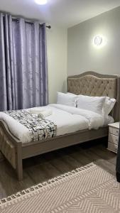 Ένα ή περισσότερα κρεβάτια σε δωμάτιο στο Amber home