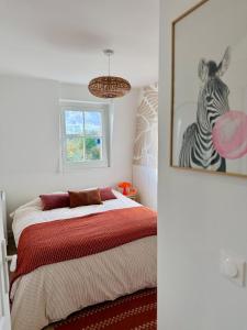 En eller flere senge i et værelse på Suite cozy pour pros et séjours confort