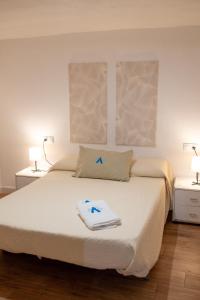 Ένα ή περισσότερα κρεβάτια σε δωμάτιο στο La bodega de la Yaya